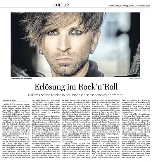 Photo of a printed newspaper article with a large image and four columns of text